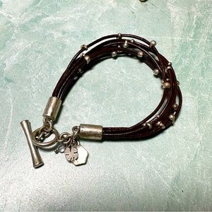 Lucky Brand multi strand brown faux leather cords silver tone charms bracelet